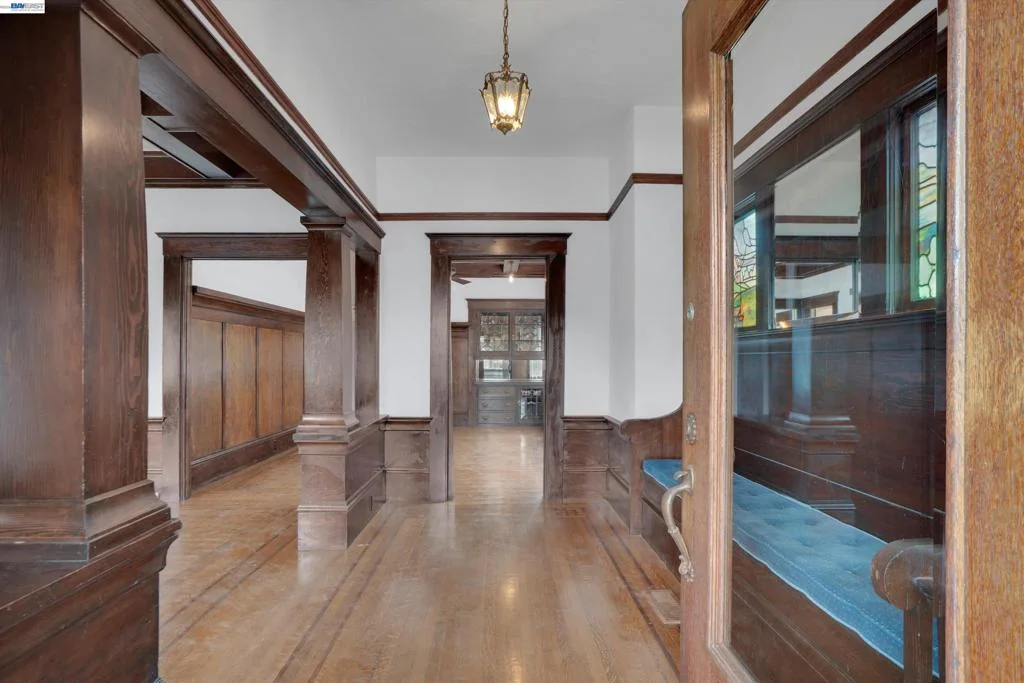 Entry hall with wood floors and original trim