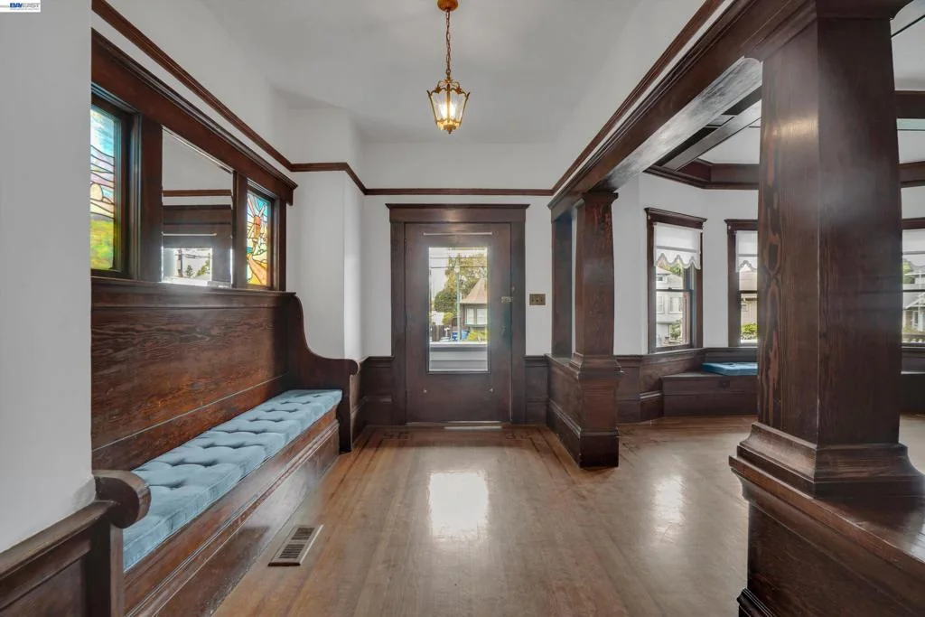 Front entry viewed from the living room with built-in window seat