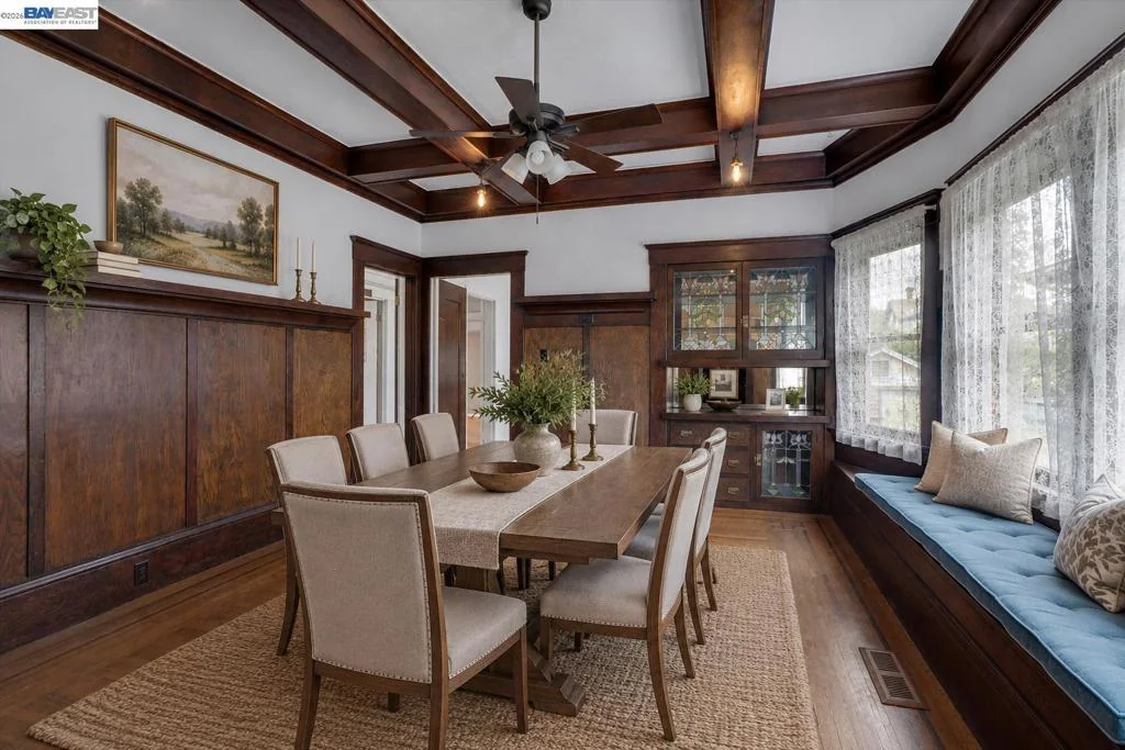 Formal dining room with coffered ceiling and original paneled walls