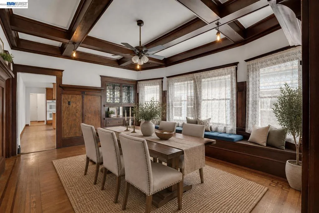 Furnished dining room with original woodwork and connected living room