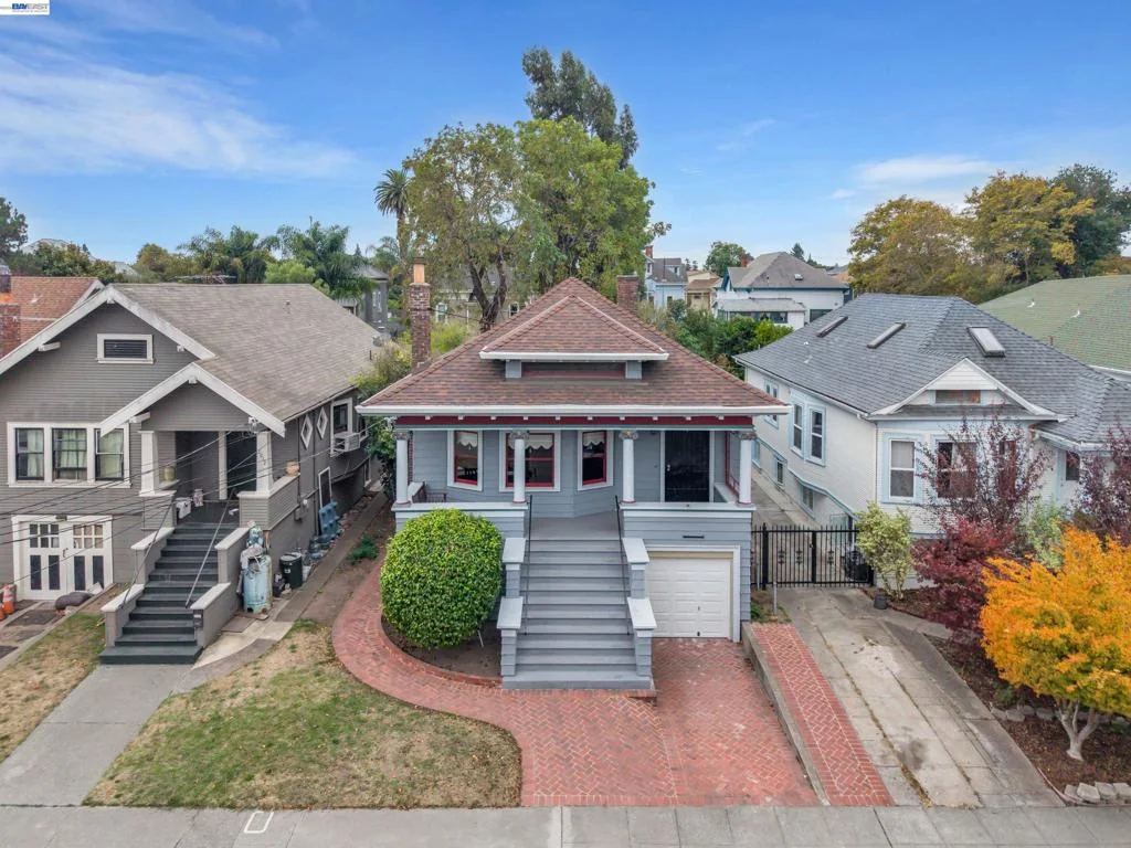 Elevated view of the front facade and covered porch